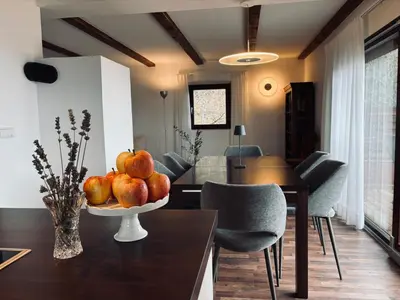 a dining room with a bowl of fruit on a table at Bergchalet Platzl in Verano