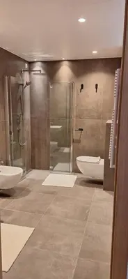 a bathroom with two sinks and a shower at Santer Klause in Merano