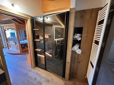 a bathroom with a glass shower in a room at Rifugio Caltena in Fiera di Primiero