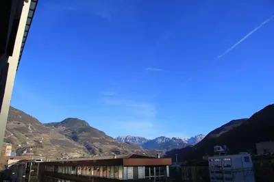 a view of a city with mountains in the background at BozenApartments Garibaldi in Bolzano