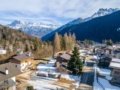 an aerial view of a village in the mountains at Ciasa al Sol in Falcade