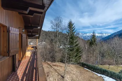 a balcony of a house with a view of the mountains at Ciasa al Sol in Falcade