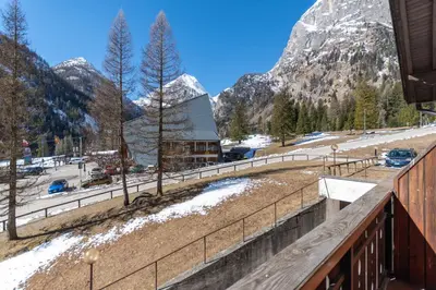 a bathroom with a shower and a toilet and a sink at Principe Marmolada 154 in Rocca Pietore