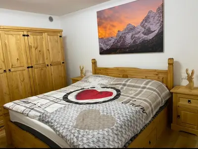 a bedroom with a bed with a heart on it at Appartamento Miramonti in Mas