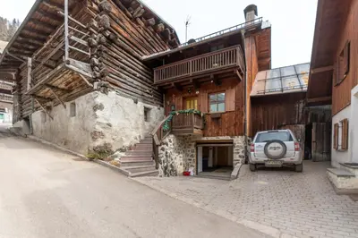 a car parked in front of a building at Appartamento Iori in Canazei