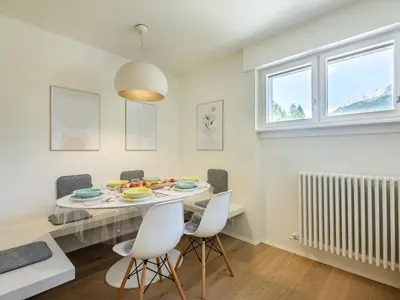 a living room with a couch and a fireplace at Apartment Enrosadira-13 by Interhome in Alba di Canazei