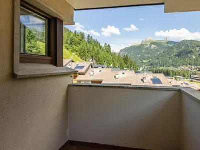 a balcony with a view of a mountain at Apartment Enrosadira-13 by Interhome in Alba di Canazei