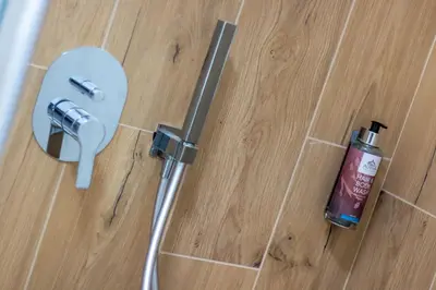 a fire extinguisher on the floor of a bathroom at Alpinia in Moena