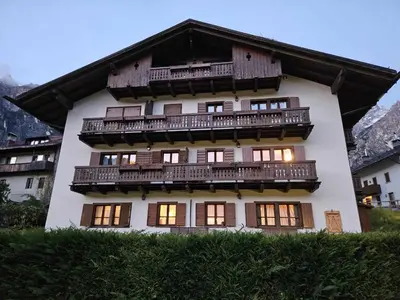 a building with balconies on the side of it at Casa elegante in San Vito di Cadore