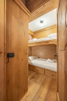 a small room with two bunk beds in it at Casa Col, vicina alle piste da sci e con vista Dolomiti in Cortina dʼAmpezzo