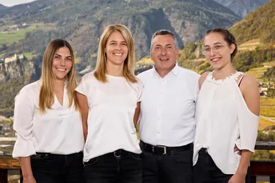a group of three people posing for a picture at Mira Sabiona Guesthouse in Gufidaun