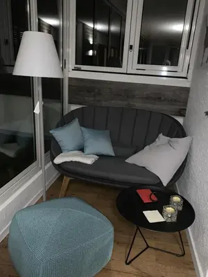 a living room with a couch and a table at Saringerhof in Rablà