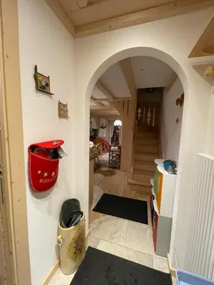a hallway of a house with an archway at Love Mountain House in Campestrin