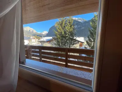 a window with a view of a mountain view at Love Mountain House in Campestrin