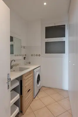 a kitchen with a sink and a washing machine at La Finestra sul Peller, Coredo Ospitar in Coredo