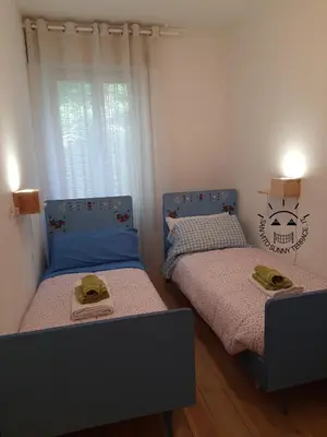 a bedroom with two beds with hats on them at San Vito Sunny Terrace IT in San Vito di Cadore