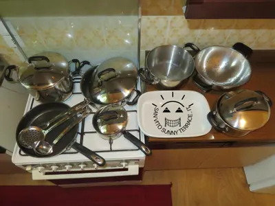 a bunch of pots and pans on a stove at San Vito Sunny Terrace IT in San Vito di Cadore