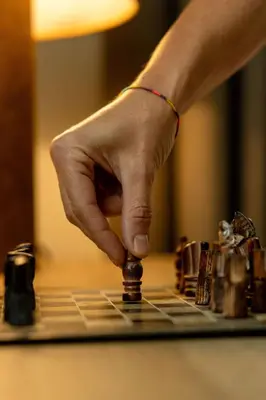 a person playing chess on a chessboard at Sass Pordoi Moena in Moena
