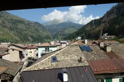 a view of a town with mountains in the background at Simi Dolomiti in Predazzo