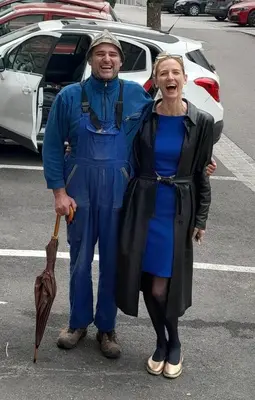 a man and a woman standing in a parking lot at Agriturismo Kabishof in Funes