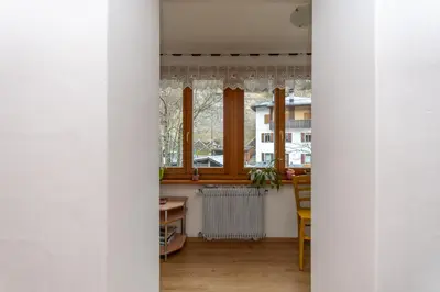 a bathroom with a washing machine and a sink at Casa Col di Frena in Falcade