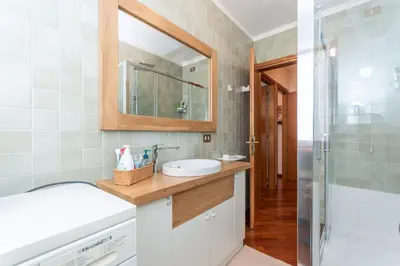 a bathroom with a sink and a mirror at Alpe Verde in Falcade