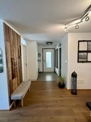 an empty room with a bench and a hallway at Apartment Wörer in Perca