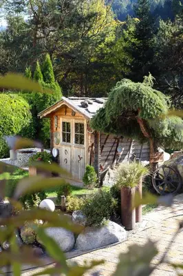 a small house in the middle of a garden at Apartment Wörer in Perca