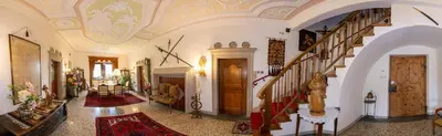 a hallway with a staircase in a house at Ansitz Wendelstein in Appiano sulla Strada del Vino