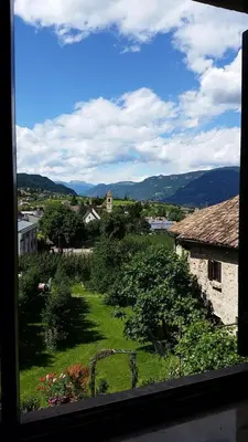 a view from a window of a village with a garden at Ansitz Wendelstein in Appiano sulla Strada del Vino