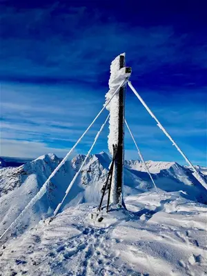 a pole on top of a snow covered mountain at Schienhof in Chiusa
