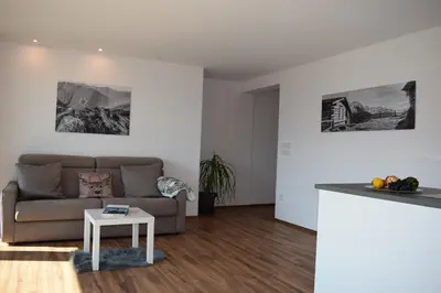a living room with a couch and a table at Residence Ladurn in Tirolo