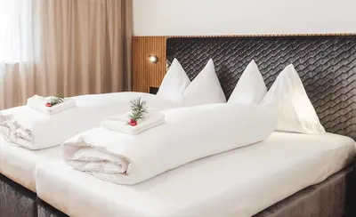 a living room with a couch and a chair at Paradeis Apartments in Mühlbach