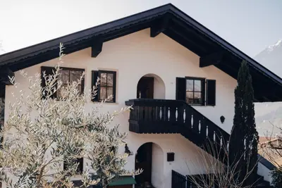 a house with a staircase on the side of it at Apartment Steinbach in Schenna