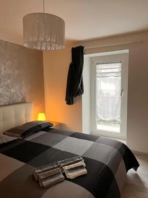 a bedroom with a bed with two towels on it at Abete Bianco in Mezzano
