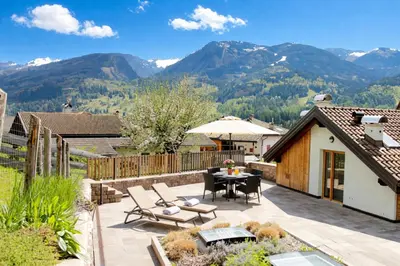 a bedroom with two beds and a window at VILLA CAVAZZAL - 2 camere, 2 bagni, garage Dolomiti Affitti in Cavalese