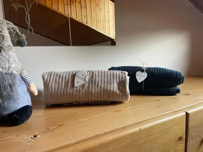two pillows on top of a wooden counter at Casa Leo By Gonewlocation in Cavalese