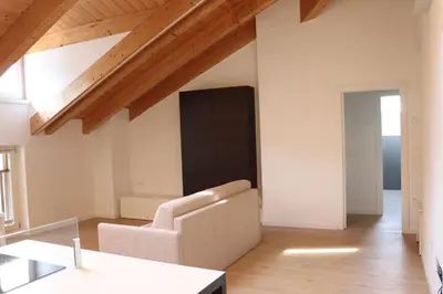 a living room with a couch and a table at Casa Dusinei Blue & Green in Cles