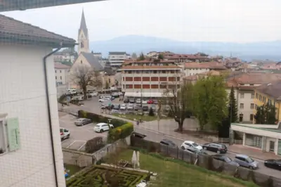 a view of a city with cars parked on a street at Casa Dusinei Blue & Green in Cles
