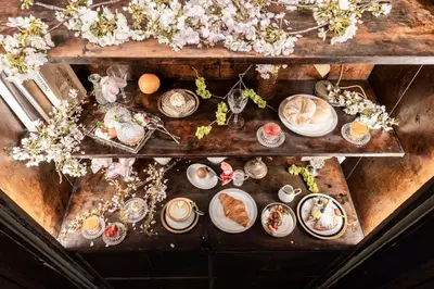 a shelf with a table with food on it at Ansitz Thierburg Suites in Merano