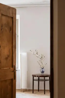 a coat hanging on a pole with a cloth on it at Ansitz Thierburg Suites in Merano