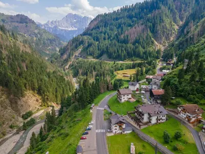 an aerial view of a village in the mountains at Col da Daut 8 in Rocca Pietore