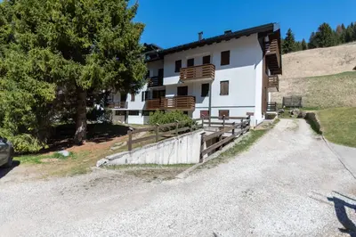 a house on the side of a hill at Chalet Baranci in Pozza di Fassa