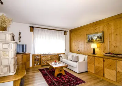 a living room with a couch and a table at Ciasa Nina in San Vito di Cadore