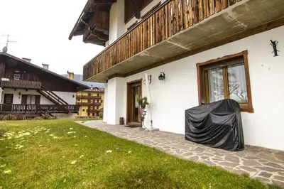 a house with a tarp on the side of it at Ciasa Nina in San Vito di Cadore