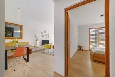 a living room with a desk and a chair at Dahoam - Gardensuite R in Schenna
