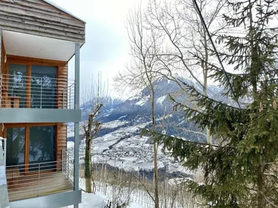 a house with a view of a mountain at Dahoam - Gardenchalet in Schenna