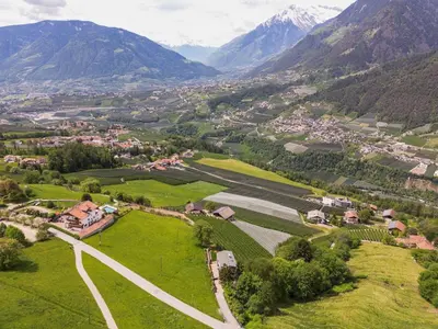 an aerial view of a village in the mountains at Dahoam - Gardenchalet in Schenna