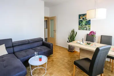 a living room with a couch and a table at Andreas Hofer Residence in Bolzano