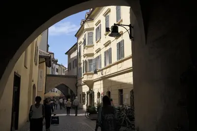 a group of people walking down a street at Andreas Hofer Residence in Bolzano